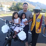 Father & 2 daughters on bicycle